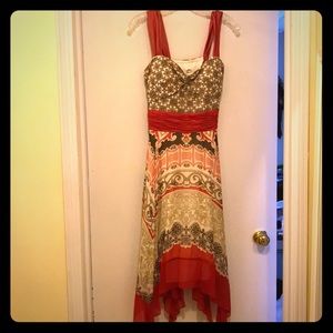 Red, brown, cream and gray patterned dress.